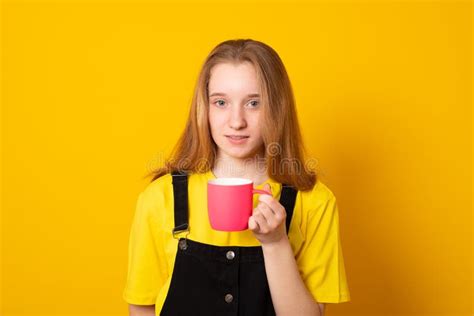 Cute Young Girl Holding A Pink Mug Stylish Teen Girl Drinking From A