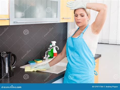 tired cleaning woman mopping floor royalty free stock image
