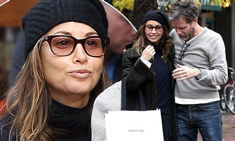 gina gershon uses body heat to stay warm during a cosy outdoor lunch