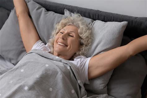 Elderly Woman Lying In Bed Stretched Arms Enjoy Good Morning Aw