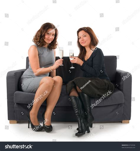 Photo De Stock Two Beautiful Women Sitting On Sofa 65732038 Shutterstock