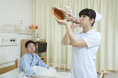 A Japanese Nurse Blowing A Horn R Wtfstockphotos