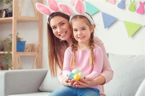 mother and daughter together at home easter preparation