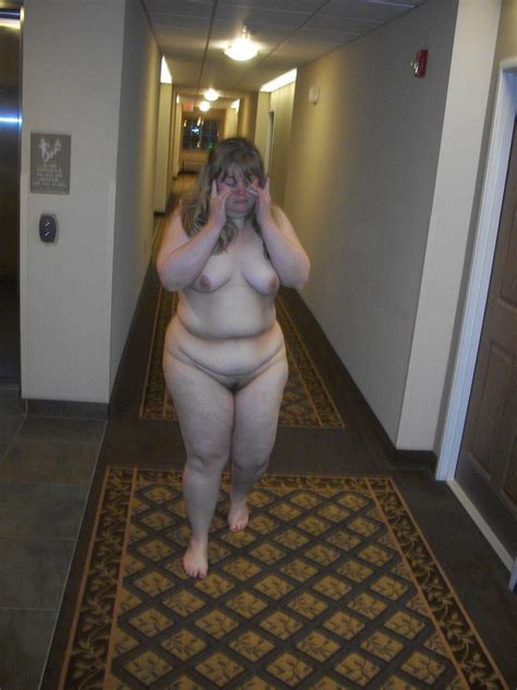 roaming around naked in a hotel hallway for all to see