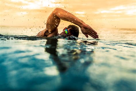 man    swim   ocean  sunrise  florida commercial photographer