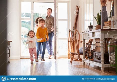 family returning home  trip   excited children running  stock image image