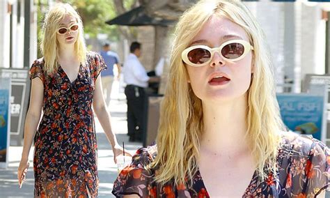 elle fanning wears semi sheer dress as she sips on ice coffee during