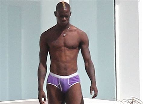 balotelli spends his days under ibiza sun surrounded by ladies