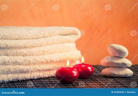 Spa Massage Border Background With Towel Stacked Stone And Red Candles