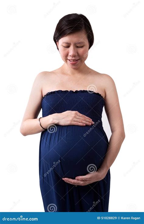 Pregnant Asian Woman Supporting Her Belly With Hands Stock Image