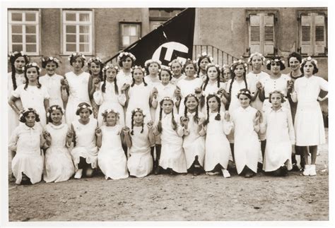 group portrait of german girls posing outside their school in front of