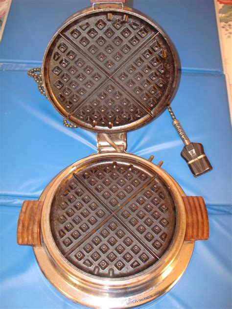 vintage electric waffle iron  dominion model  art deco wooden handles  wooden