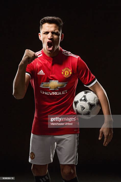 alexis sanchez of manchester united poses after signing for the club
