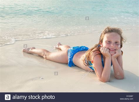 Girl Lying In Sand At Grace Bay Beach Providenciales