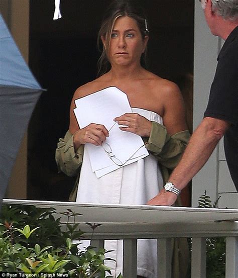 jennifer aniston gets caught outside wearing nothing but a towel