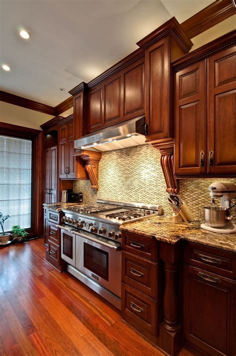 cherry kitchen cabinets  wood floors  granite