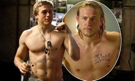 charlie hunnam is a far cry from his sons of anarchy character as he goes shirtless for new film