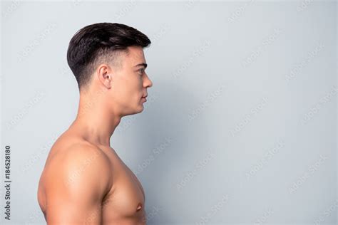 half faced profile side view portrait of confident sexy shaven with