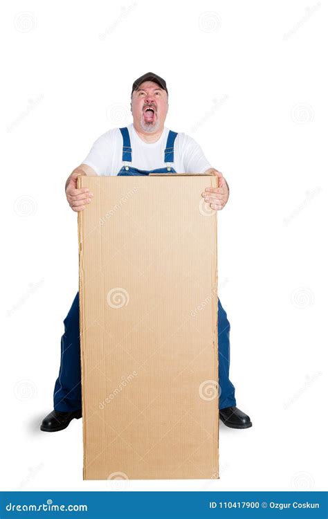 man wearing dungarees lifting heavy package stock photo image  middle full