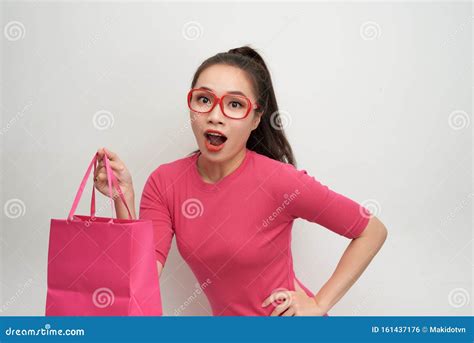 joyful woman shopping packages pink color stock photo image  packages portrait