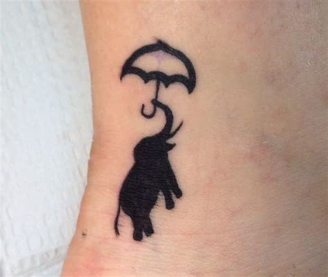 small silhouette elephant with umbrella tattoo silhouette elephant