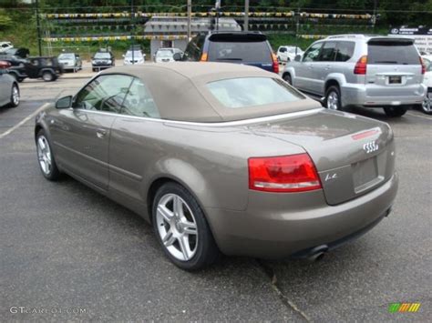 gray car parked   parking lot    cars