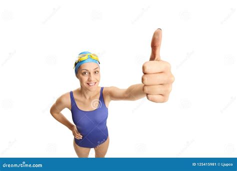 Young Woman In A Swimming Suit And Swimming Cap Showing Thumb Up Stock