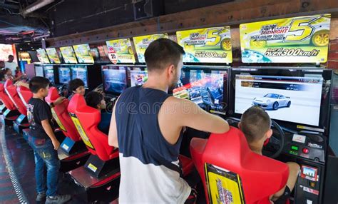 young people  teenagers play  amusement arcade bangkok