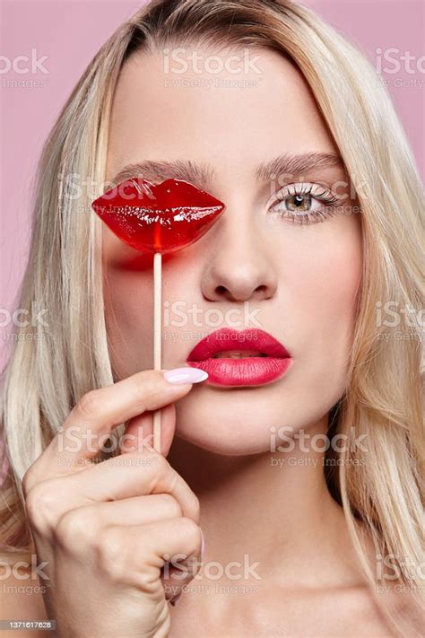 Portrait Of Blonde Woman Closing By Candy Her Eye Red Female Lips Shape