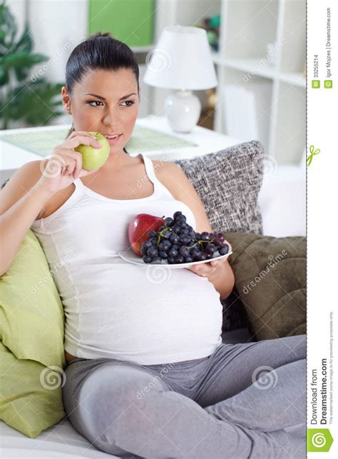 pregnant woman eating fresh fruits stock images image 33255214