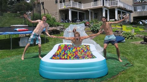 Backyard Slip N Slide Into Pool Full Of Orbeez Youtube
