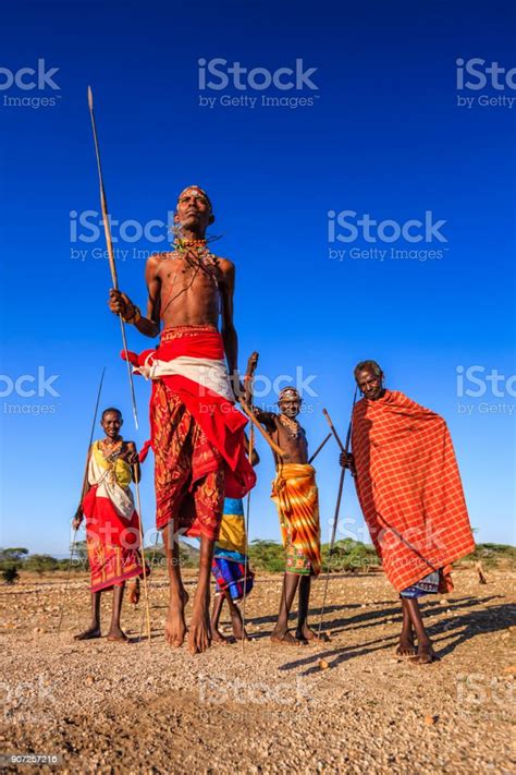 warrior from samburu tribe performing traditional jumping dance kenya