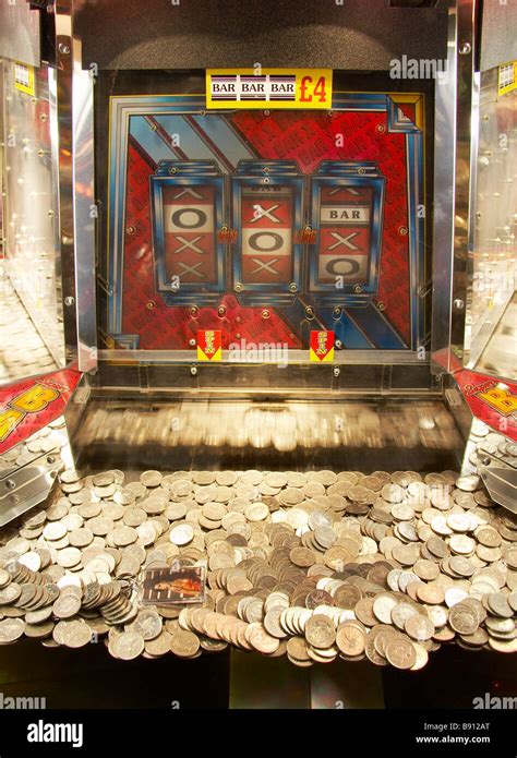 coins   slot machine  amusement arcade stock photo alamy