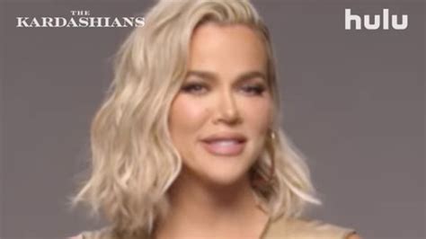 khloe kardashian shows off her tiny waist in skintight nude dress as