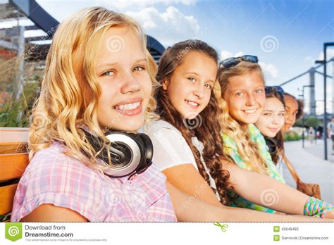 close  view  blond girl   friends stock photo image