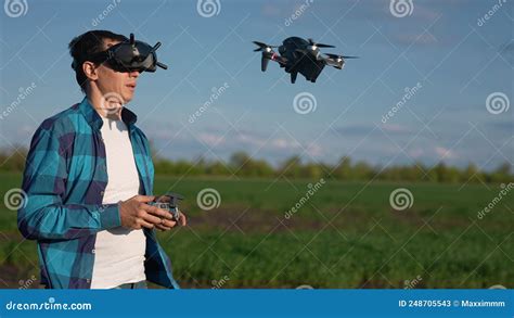 agriculture man farmer  aerial pilot drone survey explorers green wheat crops   field