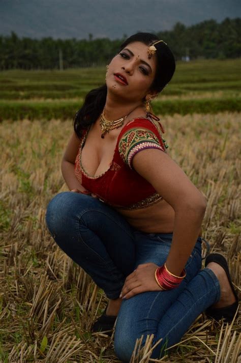 actress navel show south item girl rithvika hot stills in