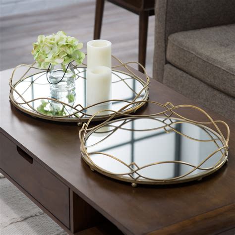 metal trays  candles  flowers sit  top   coffee table