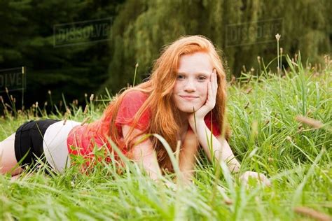 teenage girl lying    grass chilling  stock photo dissolve
