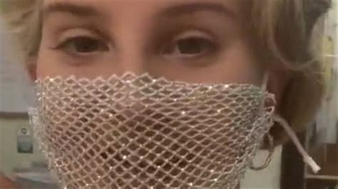 lana del rey criticised for wearing a mesh face mask to
