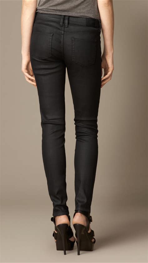 lyst burberry skinny fit low rise wax coated jeans in black