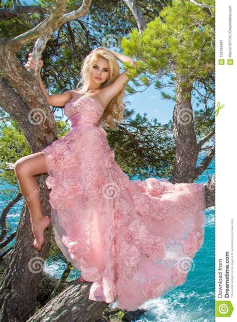 Beautiful Blonde Shapely Female Model In A Pink Ballroom