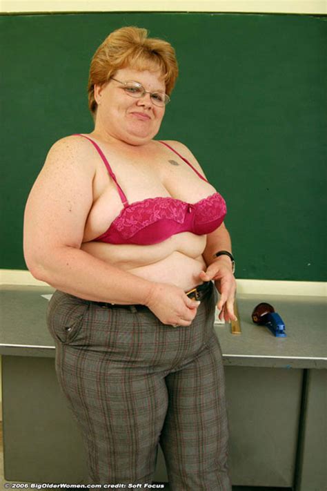 glassed fat mature teacher stripping and posing in classroom