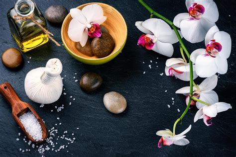 spa setting  white orchid herbal massage ball  essential