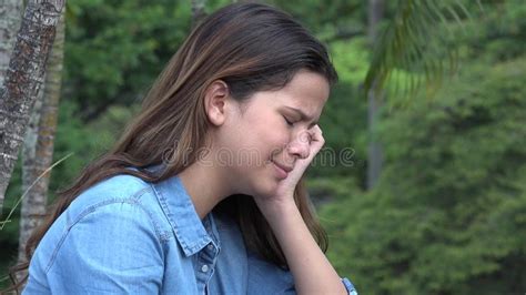 Hispanic Teen Girl Crying With Emotional Pain Stock Image
