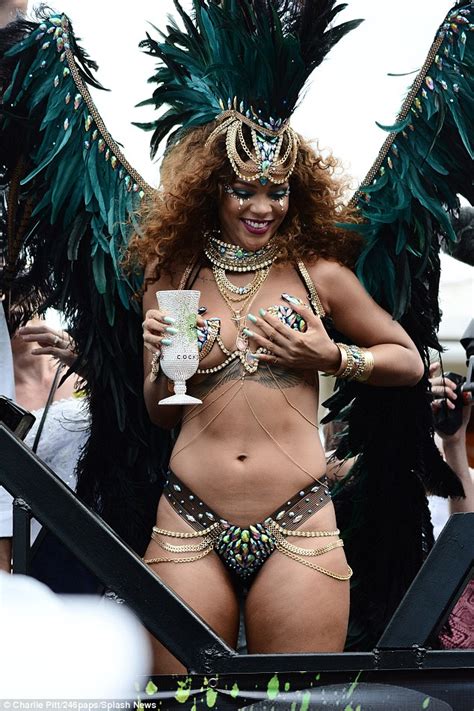 rihanna shows off her curvy figure as she parties at barbados carnival