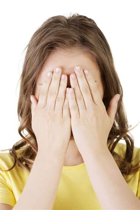 young teen woman covering  face  hands stock photo image   miserable