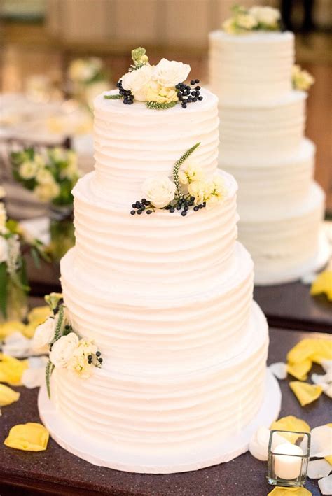 four tier white buttercream wedding cake