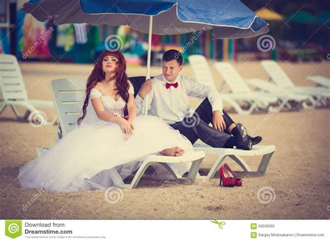 Bride And Groom On A Lounger Stock Image Image Of Pool