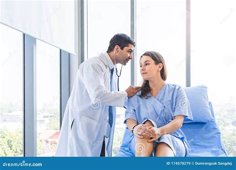 Doctor Check Up Examination For Pretty Patient At Hospital Or Medical